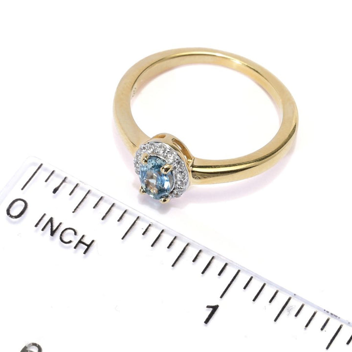 Gem Treasures 0.66ctw Oval Montana Sapphire & White Zircon Halo Ring